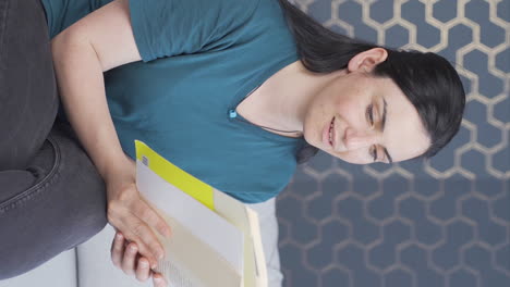 Vertical-video-of-The-woman-reading-the-book.